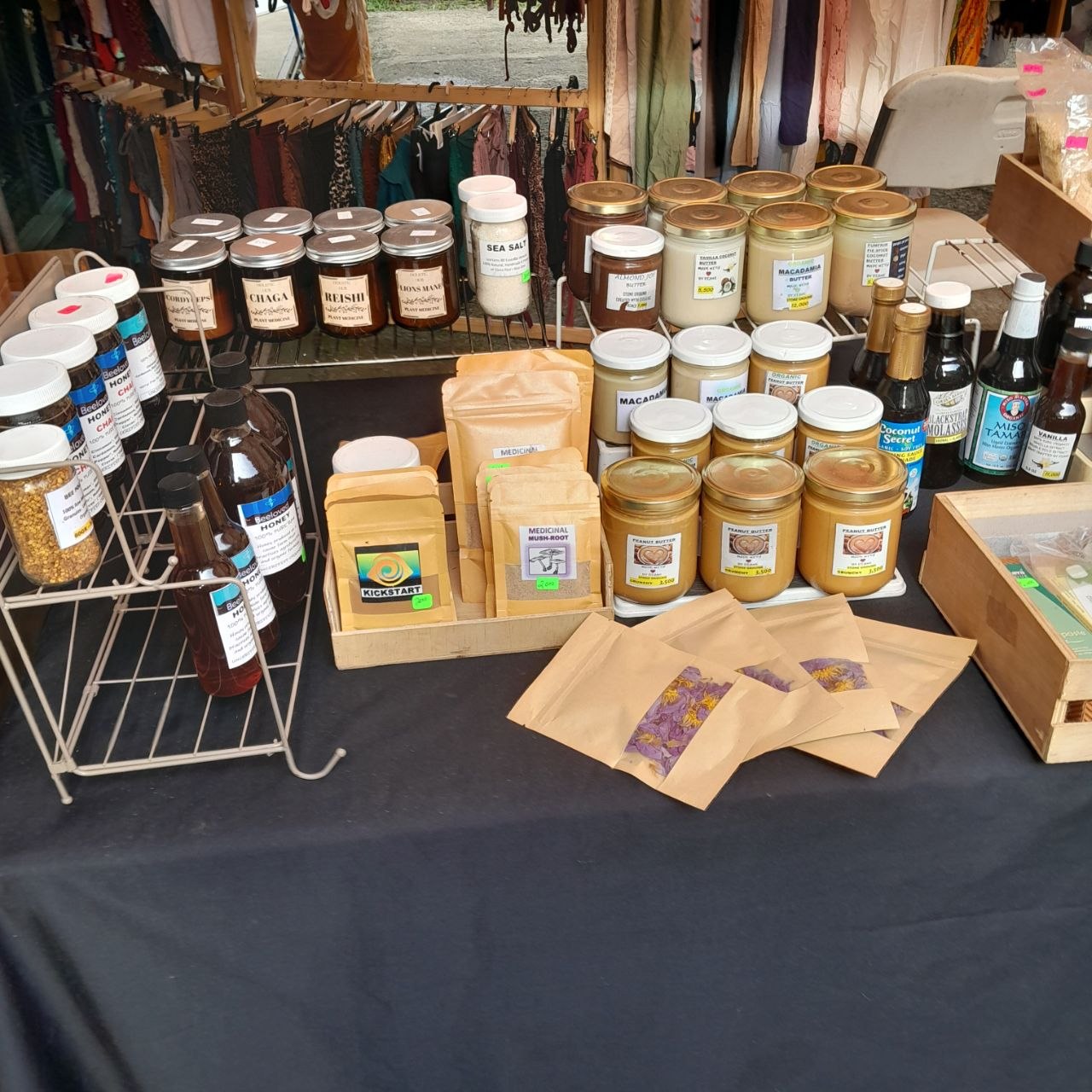 Jars of stone-ground nut butters and mushroom preparations on the stall